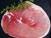 Raw gammon steak on black stone background Raw gammon steak on black stone background.