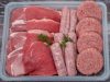 A tray containing a selection of fresh raw meats A tray containing a selection of fresh raw meats